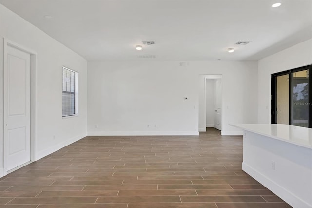 10242 Hallendale Dr, Port Charlotte, FL 33981 - unfurnished room with wood finished floors, baseboards, and recessed lighting