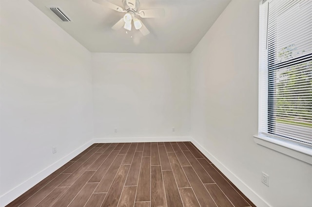 10242 Hallendale Dr, Port Charlotte, FL 33981 - unfurnished room with baseboards, dark wood-style floors, and ceiling fan