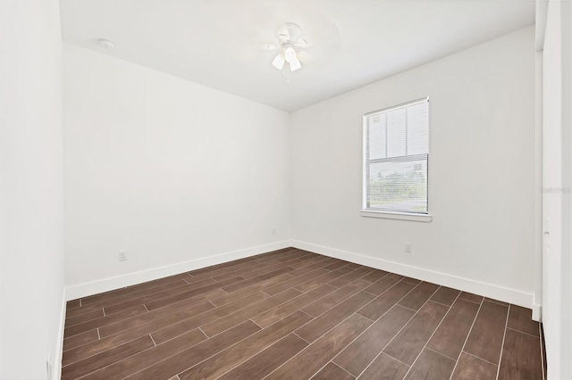 10242 Hallendale Dr, Port Charlotte, FL 33981 - empty room with baseboards, dark wood-style floors, and ceiling fan
