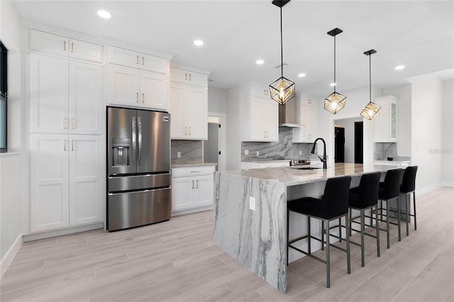 10454 Atenia St, Port Charlotte, FL 33981 - kitchen with stainless steel refrigerator with ice dispenser, baseboards, white cabinetry, decorative backsplash, and recessed lighting
