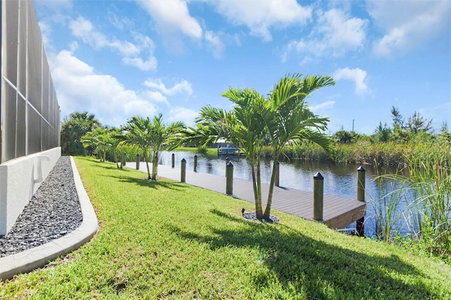 10454 Atenia St, Port Charlotte, FL 33981 - dock area with a yard, a water view, and a lanai