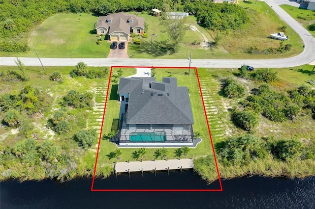 10454 Atenia St, Port Charlotte, FL 33981 - aerial overview of property's location with property parcel outlined, a pool area, and a large body of water