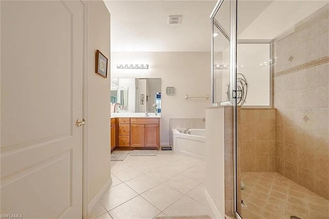 13091 Sandy Key Bnd Unit 104, North Fort Myers, FL 33903 - bathroom with a bath, tile patterned floors, vanity, and a shower stall
