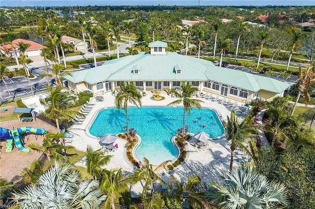 13091 Sandy Key Bnd Unit 104, North Fort Myers, FL 33903 - community pool featuring a patio and view of wooded area