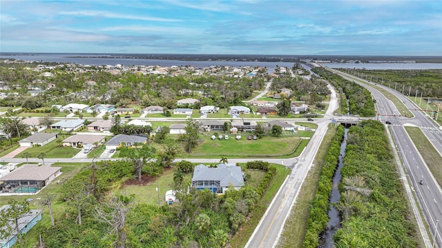 13703 Drysdale Ave, Port Charlotte, FL 33981 - aerial view of property's location featuring a main thoroughfare, nearby suburban area, and a large body of water