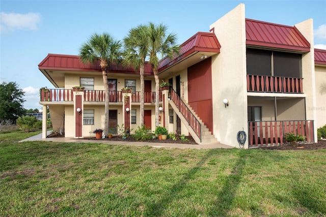 96 Boundary Blvd Unit 112, Rotonda West, FL 33947 - view of building exterior featuring stairs