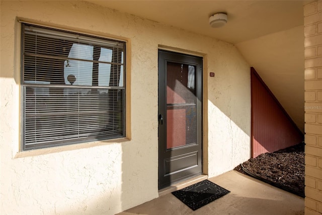 96 Boundary Blvd Unit 112, Rotonda West, FL 33947 - property entrance with stucco siding