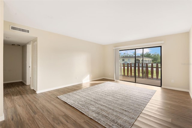 96 Boundary Blvd Unit 112, Rotonda West, FL 33947 - spare room with wood finished floors and baseboards
