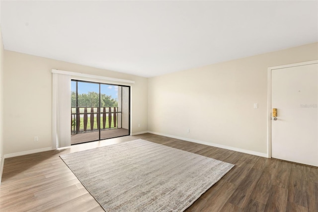 96 Boundary Blvd Unit 112, Rotonda West, FL 33947 - spare room featuring wood finished floors and baseboards