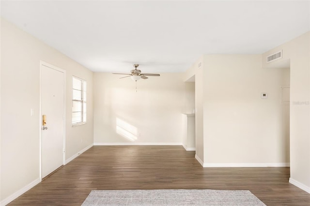 96 Boundary Blvd Unit 112, Rotonda West, FL 33947 - unfurnished living room with a ceiling fan, wood finished floors, and baseboards
