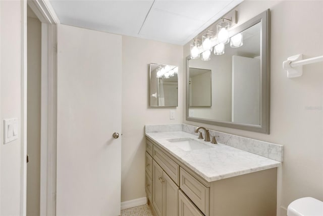96 Boundary Blvd Unit 112, Rotonda West, FL 33947 - bathroom featuring vanity, toilet, and baseboards