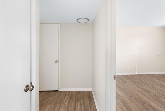 96 Boundary Blvd Unit 112, Rotonda West, FL 33947 - hallway with wood finished floors and baseboards