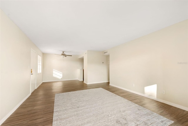 96 Boundary Blvd Unit 112, Rotonda West, FL 33947 - unfurnished room featuring ceiling fan, dark wood-style floors, and baseboards