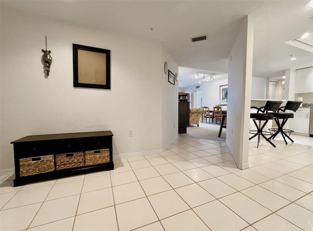 2380 N Beach Rd Unit 210, Englewood, FL 34223 - corridor featuring baseboards and light tile patterned floors