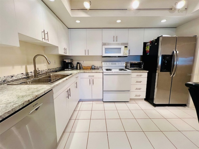 2380 N Beach Rd Unit 210, Englewood, FL 34223 - kitchen featuring stainless steel appliances, a sink, white cabinetry, and recessed lighting