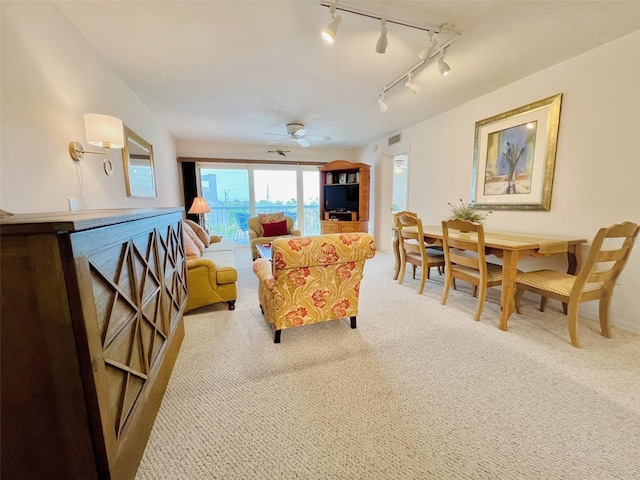 2380 N Beach Rd Unit 210, Englewood, FL 34223 - living area featuring carpet floors, track lighting, and ceiling fan