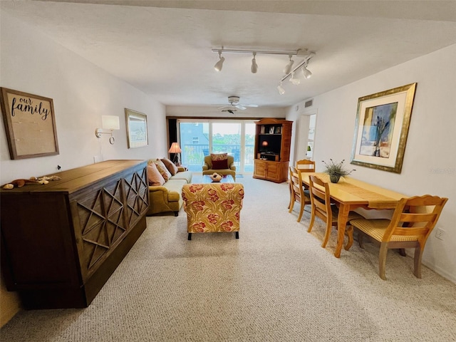 2380 N Beach Rd Unit 210, Englewood, FL 34223 - carpeted living room with a ceiling fan and track lighting