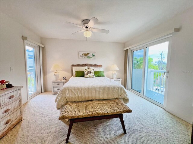 2380 N Beach Rd Unit 210, Englewood, FL 34223 - carpeted bedroom featuring access to outside and a ceiling fan