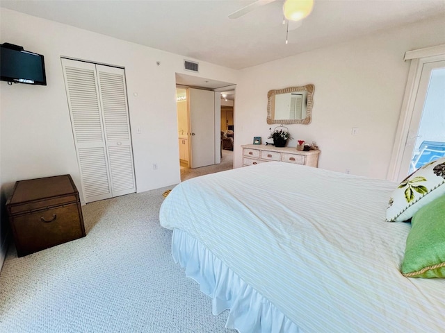 2380 N Beach Rd Unit 210, Englewood, FL 34223 - bedroom with light colored carpet, a closet, and a ceiling fan