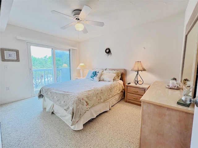 2380 N Beach Rd Unit 210, Englewood, FL 34223 - bedroom with access to exterior, light colored carpet, and ceiling fan