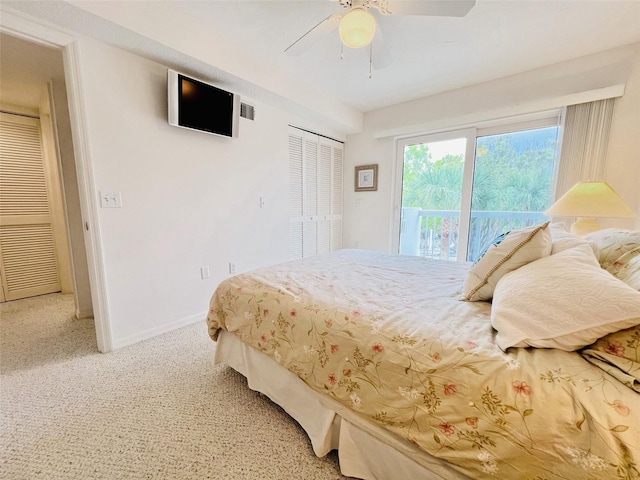 2380 N Beach Rd Unit 210, Englewood, FL 34223 - bedroom with access to exterior, light carpet, a ceiling fan, and baseboards