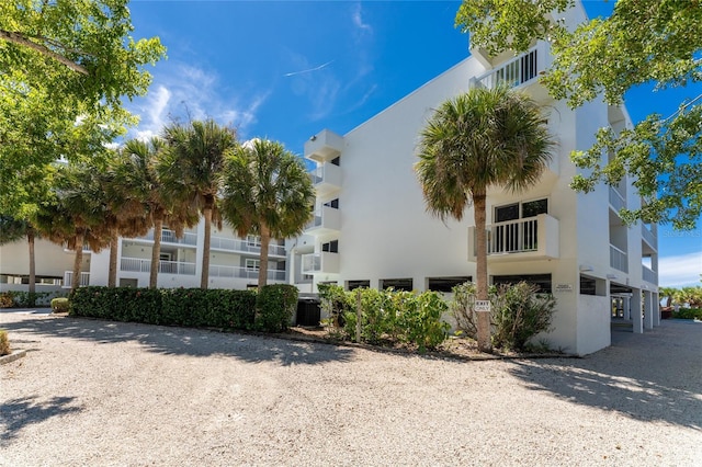 2380 N Beach Rd Unit 210, Englewood, FL 34223 - view of building exterior featuring central AC