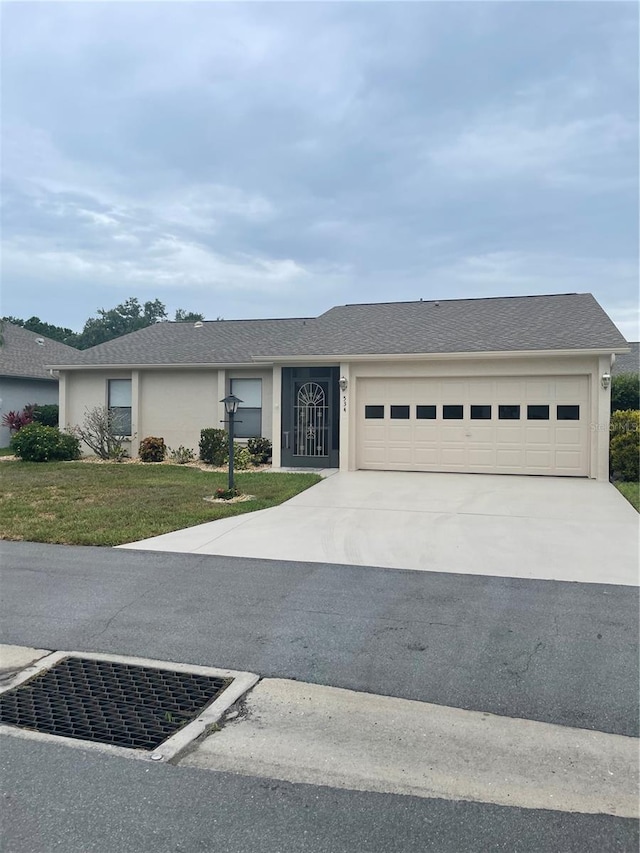 534 Wekiva River Ct Unit 103, Englewood, FL 34223 - single story home featuring concrete driveway, a garage, and stucco siding