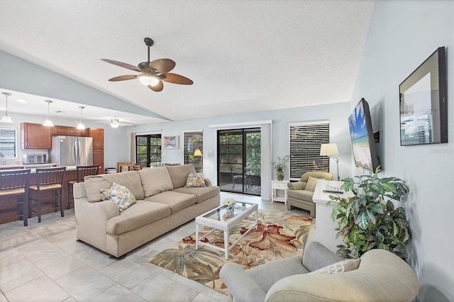 534 Wekiva River Ct Unit 103, Englewood, FL 34223 - living room with lofted ceiling, ceiling fan, and a textured ceiling