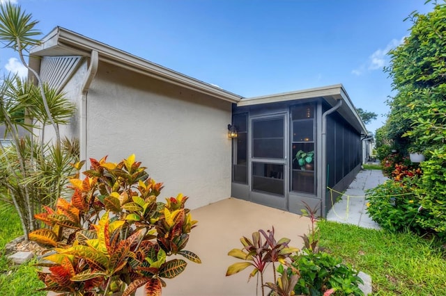 534 Wekiva River Ct Unit 103, Englewood, FL 34223 - rear view of property featuring stucco siding and a patio