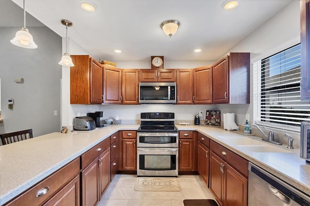 534 Wekiva River Ct Unit 103, Englewood, FL 34223 - kitchen featuring stainless steel appliances, a sink, light countertops, and recessed lighting