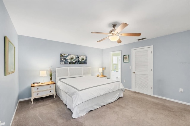 534 Wekiva River Ct Unit 103, Englewood, FL 34223 - bedroom featuring carpet floors, baseboards, ceiling fan, and ensuite bathroom