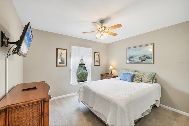 534 Wekiva River Ct Unit 103, Englewood, FL 34223 - carpeted bedroom featuring baseboards and a ceiling fan