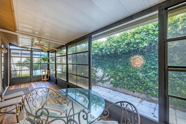 534 Wekiva River Ct Unit 103, Englewood, FL 34223 - sunroom / solarium with a ceiling fan and outdoor dining area