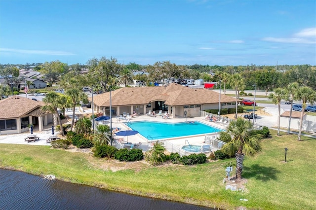 534 Wekiva River Ct Unit 103, Englewood, FL 34223 - community pool featuring a water view, a patio, and a yard