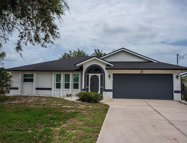 21 Sportsman Way, Rotonda West, FL 33947 - ranch-style house with a garage, stucco siding, driveway, a shingled roof, and a front lawn