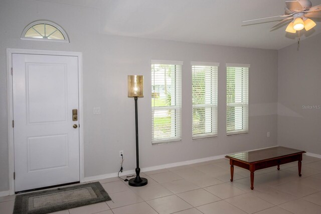 21 Sportsman Way, Rotonda West, FL 33947 - entrance foyer with plenty of natural light, a ceiling fan, and baseboards