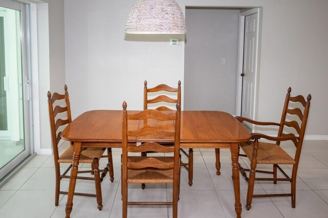 21 Sportsman Way, Rotonda West, FL 33947 - dining room featuring light tile patterned floors and baseboards