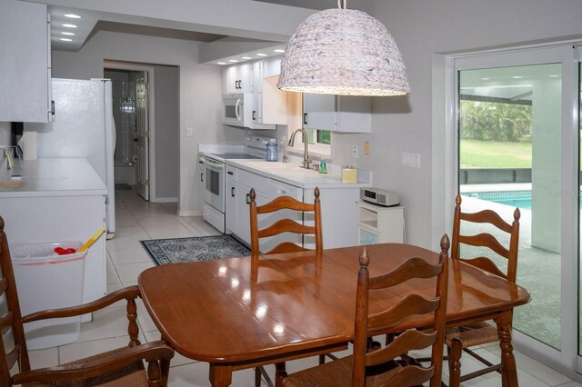21 Sportsman Way, Rotonda West, FL 33947 - dining area featuring light tile patterned floors and baseboards