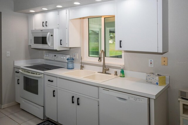 21 Sportsman Way, Rotonda West, FL 33947 - kitchen featuring white appliances, a sink, white cabinetry, and light countertops