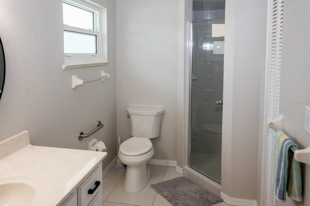 21 Sportsman Way, Rotonda West, FL 33947 - full bathroom with vanity, toilet, tile patterned flooring, a shower stall, and baseboards