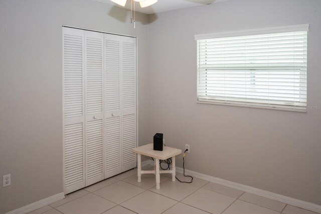 21 Sportsman Way, Rotonda West, FL 33947 - unfurnished dining area with a ceiling fan, baseboards, and light tile patterned floors