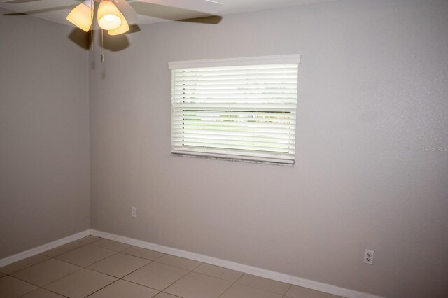 21 Sportsman Way, Rotonda West, FL 33947 - empty room featuring ceiling fan, baseboards, and light tile patterned floors