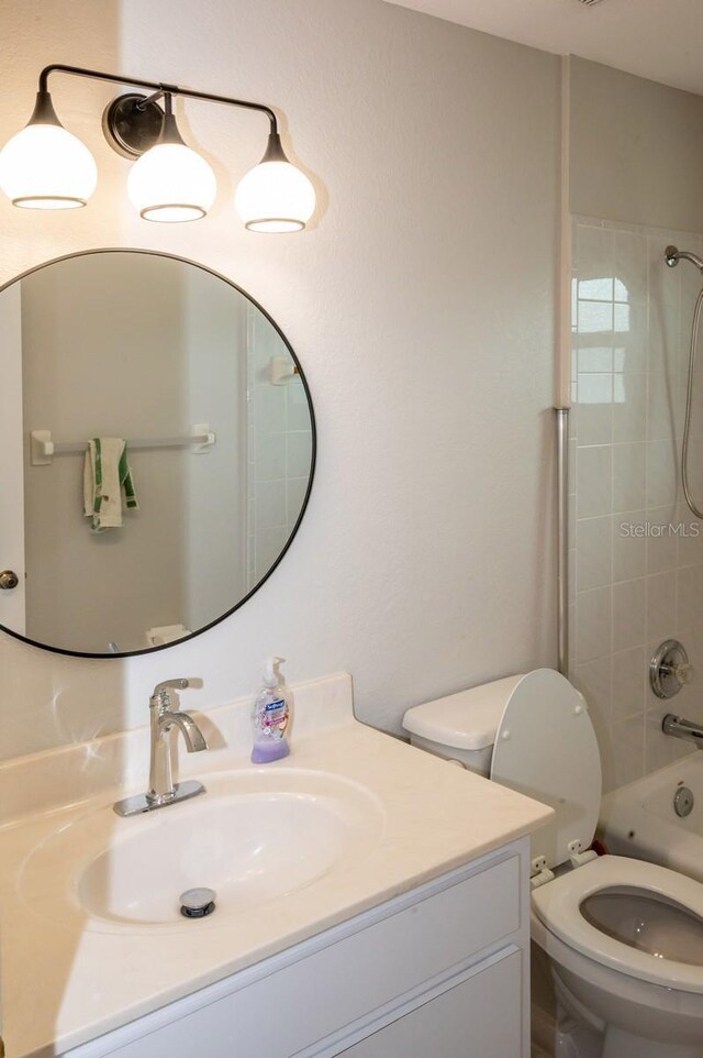 21 Sportsman Way, Rotonda West, FL 33947 - bathroom with vanity, toilet, and shower / tub combination