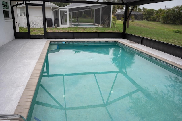 21 Sportsman Way, Rotonda West, FL 33947 - swimming pool with glass enclosure and a yard