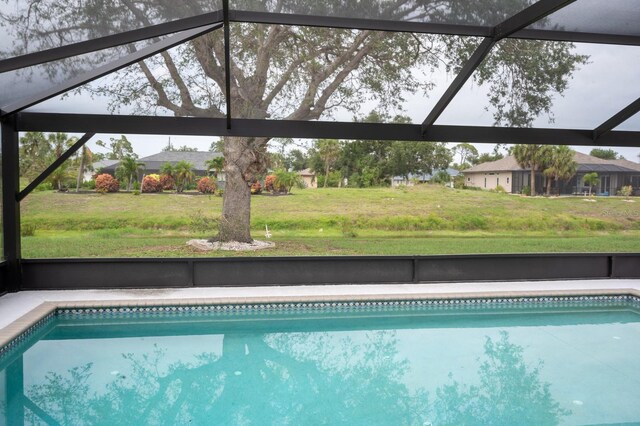 21 Sportsman Way, Rotonda West, FL 33947 - outdoor pool featuring a yard and a lanai