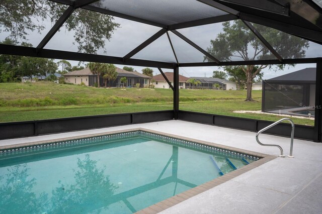 21 Sportsman Way, Rotonda West, FL 33947 - swimming pool featuring a patio area, glass enclosure, a yard, and a residential view