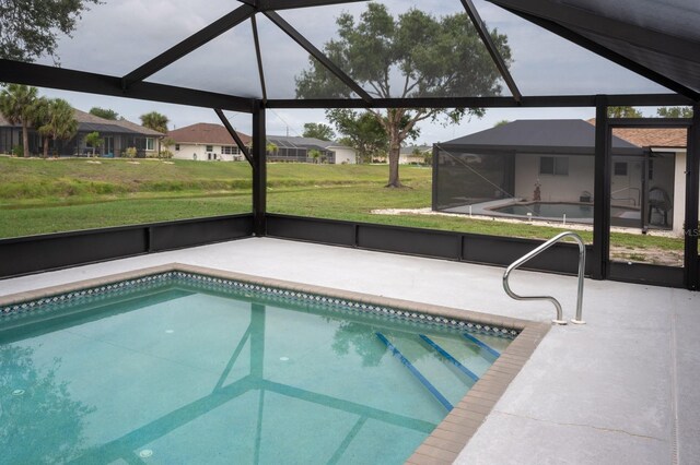 21 Sportsman Way, Rotonda West, FL 33947 - outdoor pool featuring a patio, glass enclosure, a lawn, and a residential view
