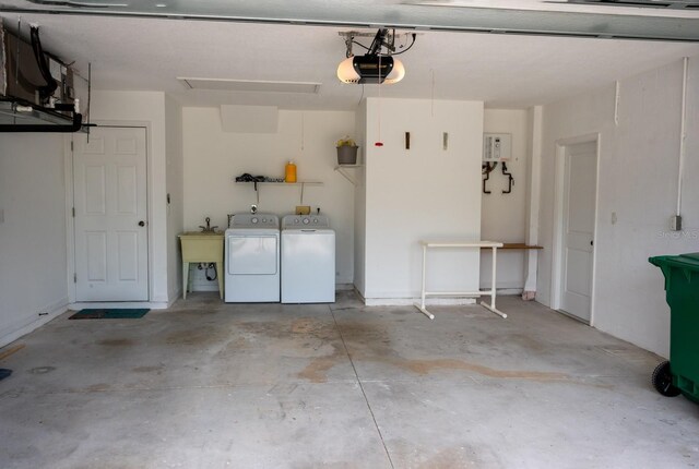 21 Sportsman Way, Rotonda West, FL 33947 - garage with independent washer and dryer, a garage door opener, and a sink