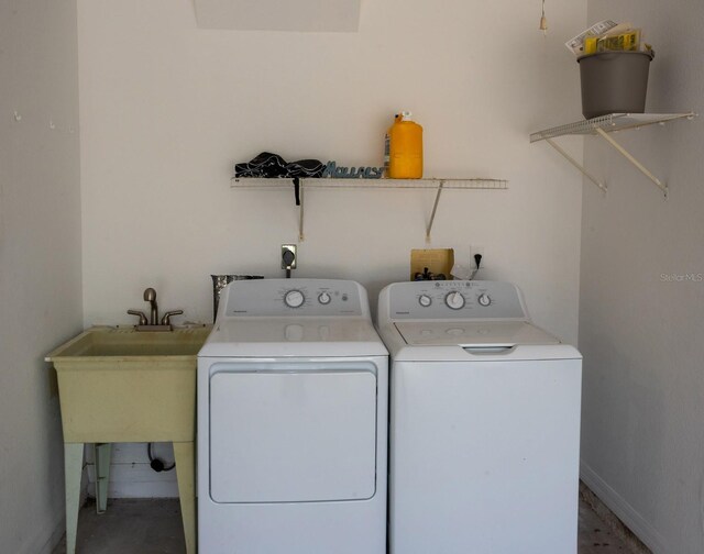 21 Sportsman Way, Rotonda West, FL 33947 - laundry room featuring washer and clothes dryer and baseboards