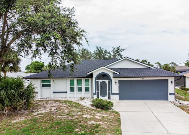 21 Sportsman Way, Rotonda West, FL 33947 - ranch-style home with stucco siding, a shingled roof, an attached garage, and driveway